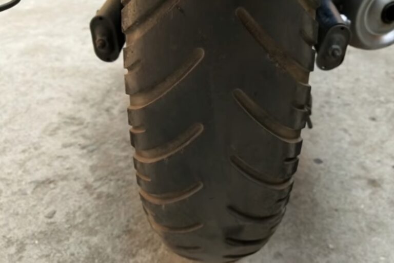 Why is the front tire of a motorcycle thinner than the rear?